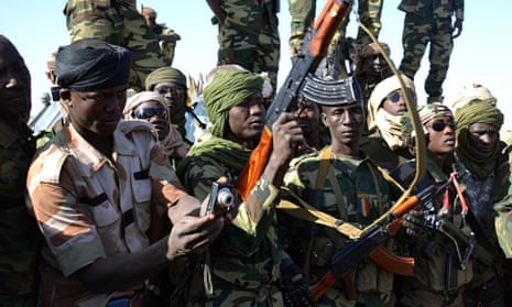Chadian soldiers gather near the Nigerian town of Gambaru