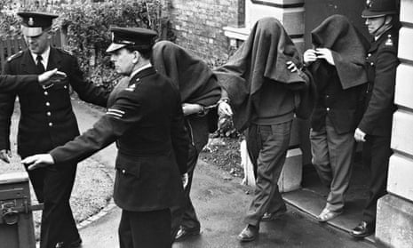 Three of the suspects arrested in connection with the ‘Great Train Robbery’, photographed leaving Linslade court with blankets over their heads.
