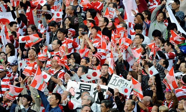 Japanese fans celebrate a famous victory in the Rugby World Cup against South Africa in Brighton