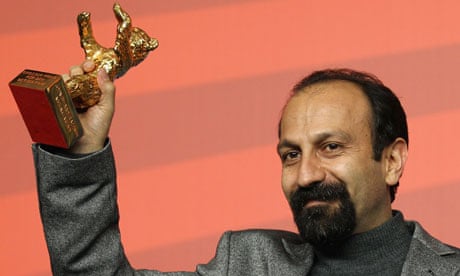 Asghar Farhadi poses with Golden Bear prize at Berlin Film Festival