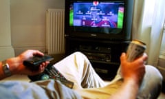 A man watching football on television 