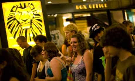 Theatregoers outside The Lion King at the Minskoff Theatre in New York