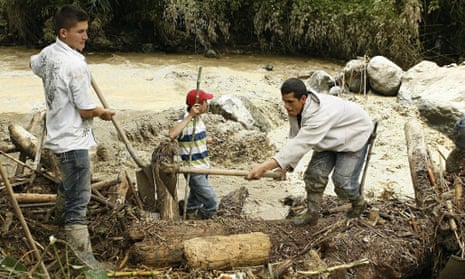 Salgar, Colombia, rescuers at riverbank
