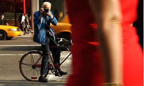 Photographer Bill Cunningham shooting on the street in New York