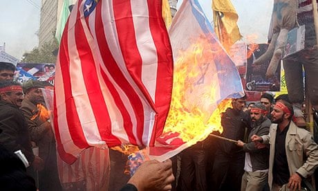 Iranians burning US flags during a demonstration to mark the anniversary of 1979 US embassy takeover