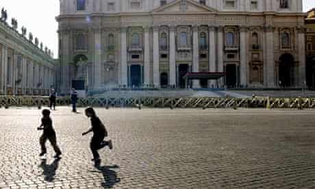 Children play in St Peters' Square at the Vatican. 