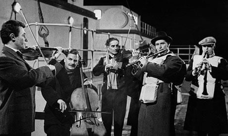 The band plays on as the Titanic sinks – a still from the 1958 film A Night To Remember