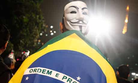 A Brazilian protester in Sao Paulo wears a Guy Fawkes mask made famous by the film V for Vendetta 