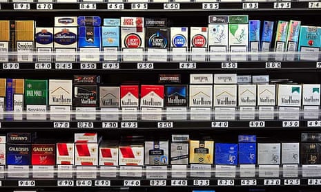 Packets of cigarettes in a London shop. Britain plans before May to become the second country in the world to introduce non-branded, standardised packaging for cigarettes.