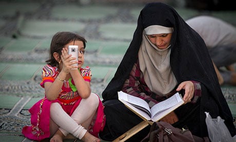An Iranaian woman and her daughter at a mosque during Ramadan.