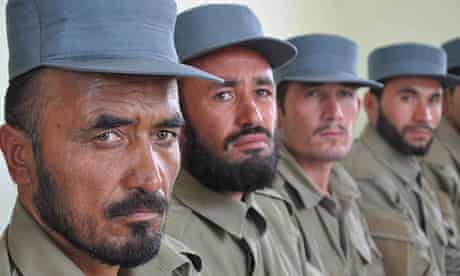 Afghan policemen attend their graduation ceremony in Afghanistan's Jawzjan province. 