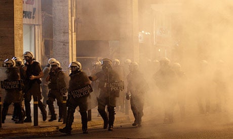 Athens riot police fire tear gas at an anti-fascist protest calling for action against Golden Dawn