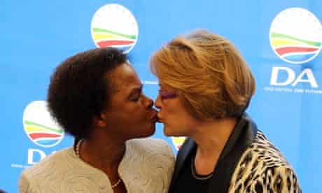 anti-apartheid activist Mamphela Ramphele, left, greets Helen Zille, head of the Democratic Alliance