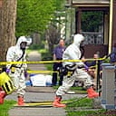 The FBI's hazardous materials response team entering the home of artist Steven Kurtz
