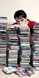 Alexis Petridis with piles of CDs
