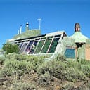 An earthship, constructed out of recycled materials