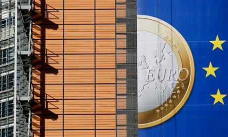 A banner on a building in Brussels showing a Euro coin 