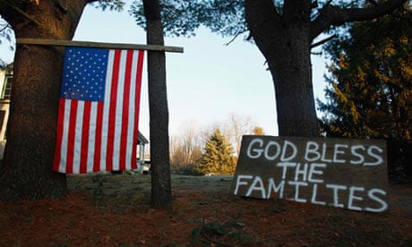 A sign and a US national flag are seen near Sandy Hook Elementary School