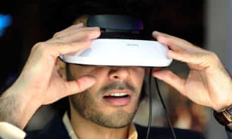 An attendee uses a Sony personal 3D viewer at CES