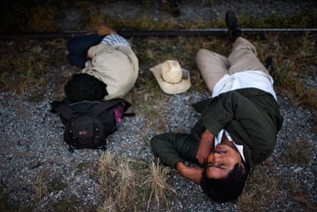 Two men sleep next to the train tracks on Arriaga, Chiapas