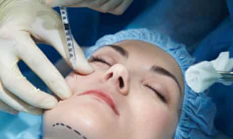 Young woman having facial plastic surgery