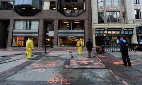 The Boston fire department hazardous materials team clean the blast site