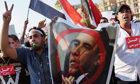 Egypt protesters carry anti-Obama posters