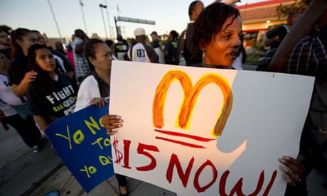 Fast food workers and their supporters picket outside a Burger King in Los Angeles