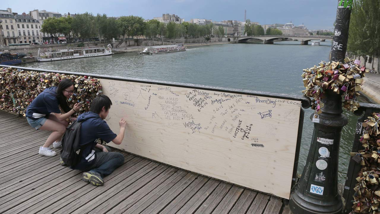 Part Of Parisian Bridge Collapses Under The Weight Of Love Locks Video World News The Guardian