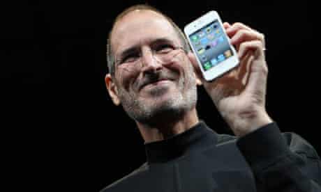 File phot of Apple CEO Steve Jobs posing with the new iPhone 4 in San Francisco