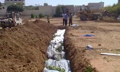 mass burial for the victims whom activists said were killed by forces loyal to Syria's president