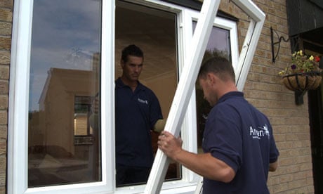 Double glazing being fitted to reduce heat loss