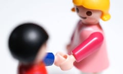 Two child's toys shaking hands