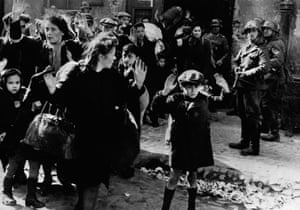 Europe 1900-1945: Terrified Jewish families surrender to German soldiers in the Warsaw ghetto