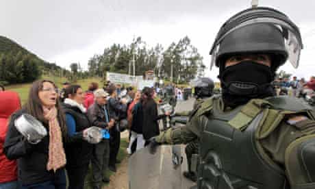 Demonstrators and riot policemen near Bogota Colombia