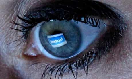 Facebook reflected in woman's eye