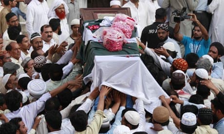 Men carry body of Muslim cleric Sarfraz Naeemi