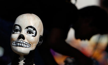 A doll's head, painted as a skull, as part of Day of the Dead celebrations in Mexico City
