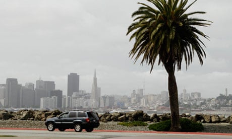 A car drives along the Avenue of the Palms on Treasure Island in San Francisco
