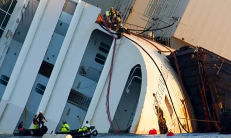 Engineers work on the bow of the Costa Concordia