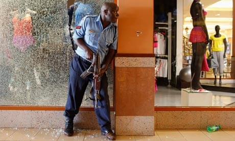 A police officer tries to secure an area inside the Westgate Shopping Centre where gunmen went on a 