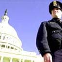 A policeman guards the Capitol