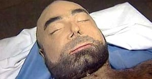 saddam hussein uday sons body son qusay bodies morgue 2003 bullet their military shown guardian displayed