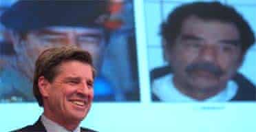 Paul Bremer, the senior US administrator in Iraq, smiles after announcing that former Iraqi leader Saddam Hussein was captured, during a news conference in Baghdad