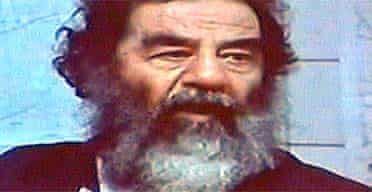 Video image of captured former Iraqi leader Saddam Hussein displayed at a news conference in Baghdad