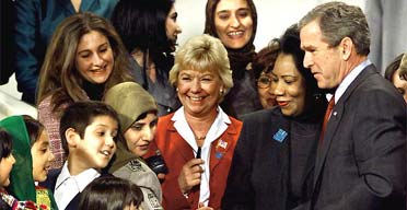 George Bush after signing law to help Afghan women at the National Museum of Women in the Arts in Washington, in December 2001