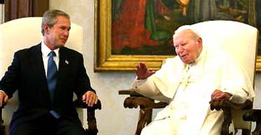 US president George Bush with Pope John Paul II in his private library at the Vatican. Photograph: Charles Dharapak/AP