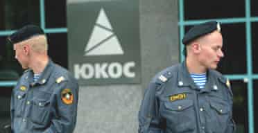 Russian special forces stand guard in front of the Yukos headquarters in Moscow. Photograph: Alexander Zemlianichenko/AP