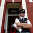 A police officer guards a house in north London after an anti-terror raid