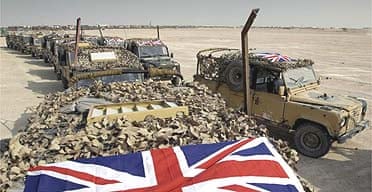 Union flag-bedecked Land Rovers of the Black Watch regiment stand ready for deployment